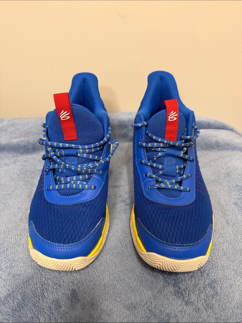 Under Armour Kids Blue Sneakers with Yellow and Red Accents